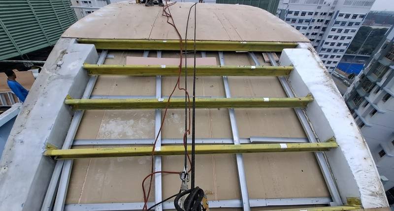 Metal roofing installation in progress on a Singapore building by Skyline Rope Tech
