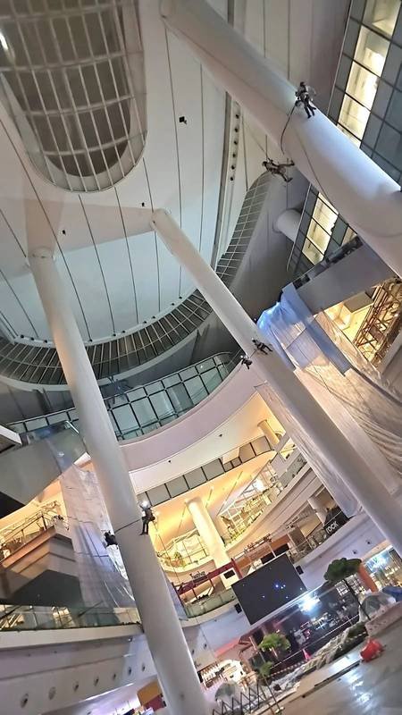 Skyline Rope Tech rope access crew on ropes inside a multi-storey atrium in Singapore
