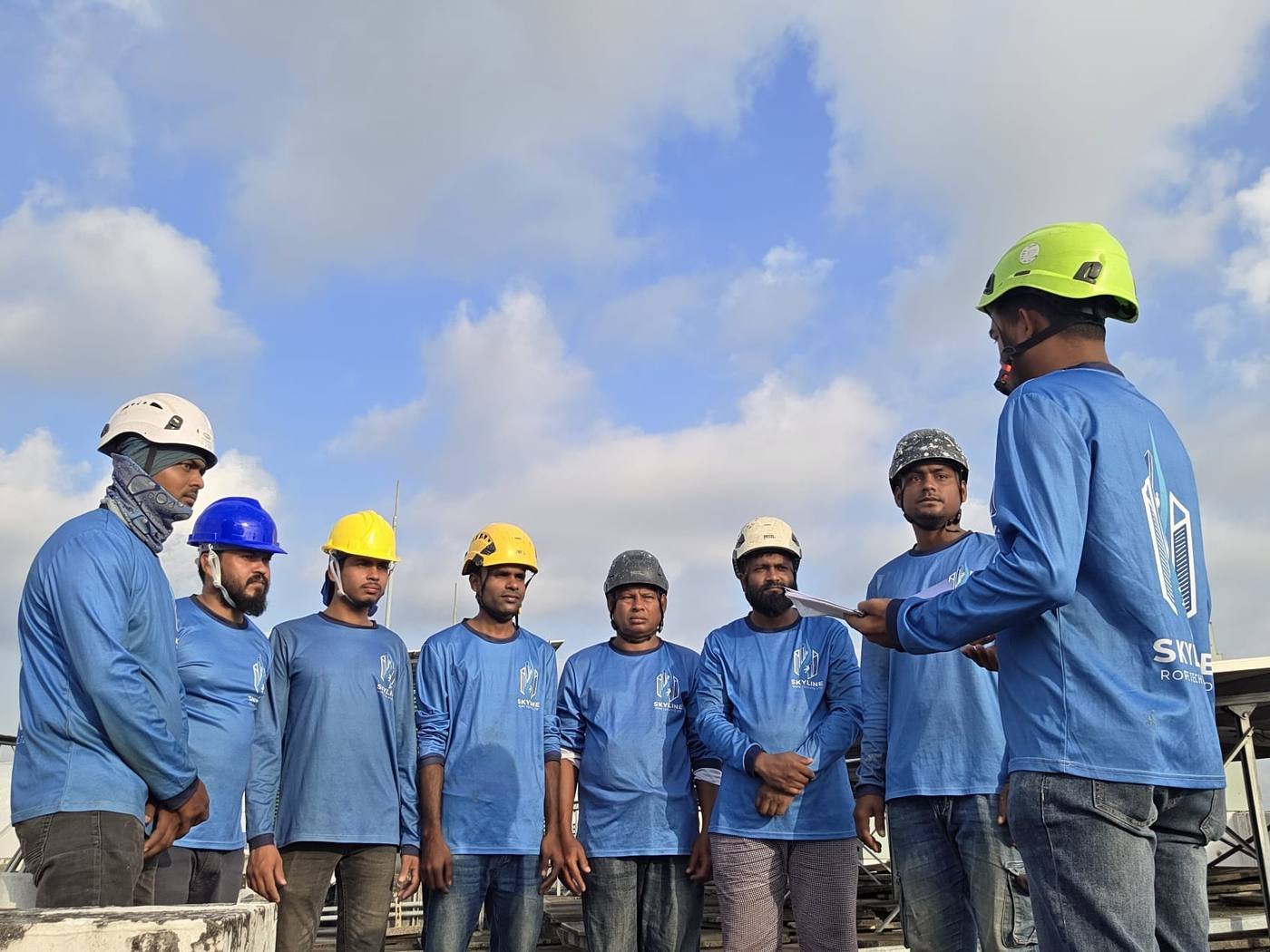 Skyline Rope Tech supervisors briefing the rope access crew before MCST elevation work in Singapore