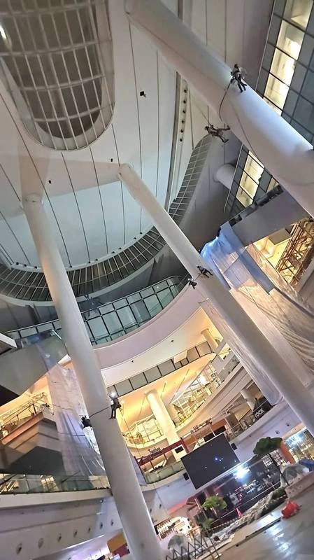 Skyline Rope Tech rope access technicians on ropes inside a multi-storey Singapore atrium