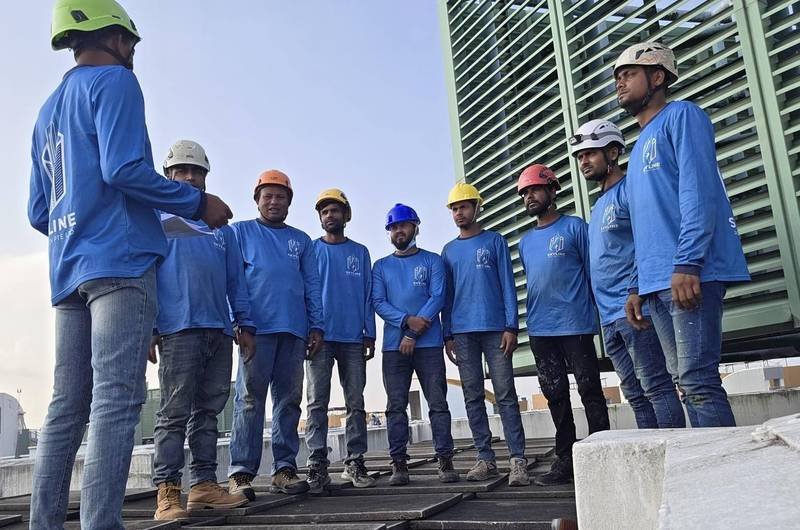 Skyline Rope Tech specialists assembled on a roof before elevation work in Singapore